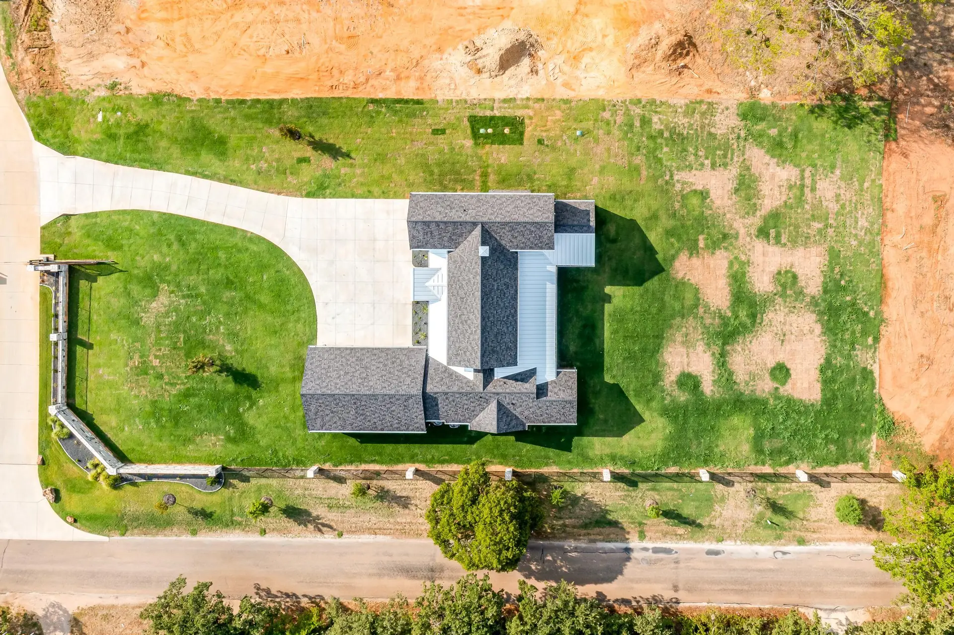 Aerial view of a TNT Builders custom home under construction near Burleson, Texas